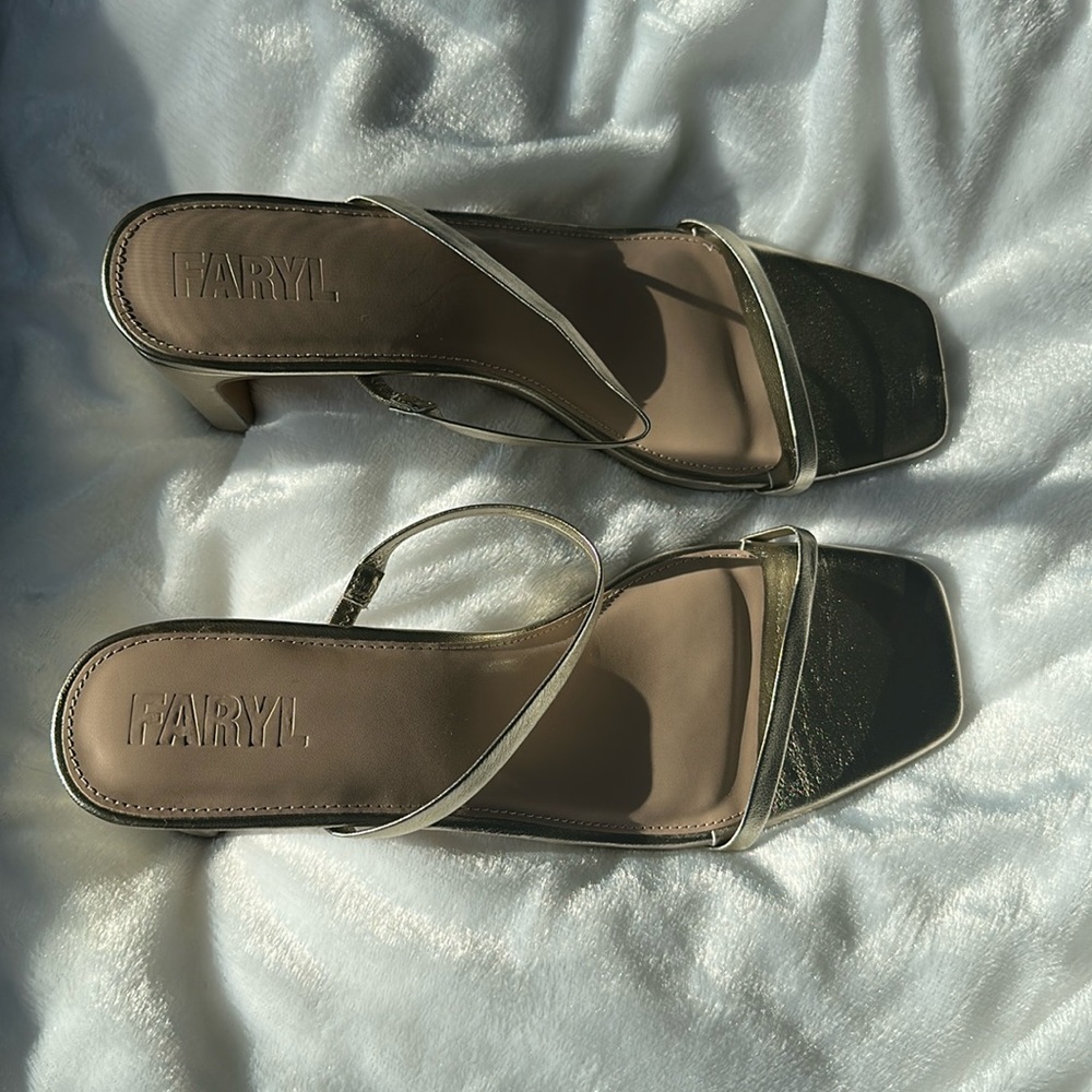 Size 12 new in box 
Elegant Gold and White Women's Sandals
